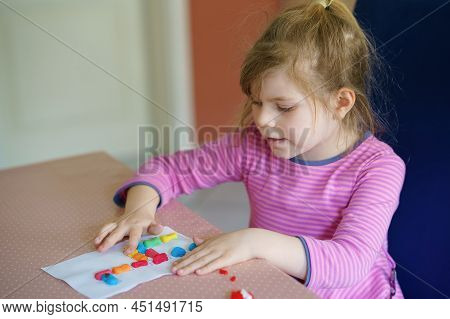 Little Creative Toddler Girl Making Colorful Giraffe With Playmais. Active Happy Child Having Fun Wi
