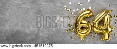 Yellow Foil Balloon Number, Number Sixty Four On A Concrete Background. Greeting Card With The Inscr