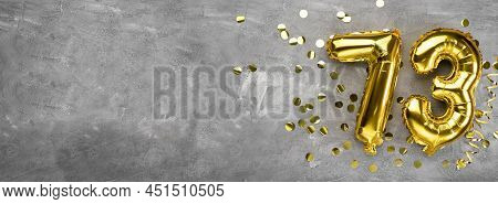 Yellow Foil Balloon Number, Number Seventy Three On A Concrete Background. Greeting Card With The In