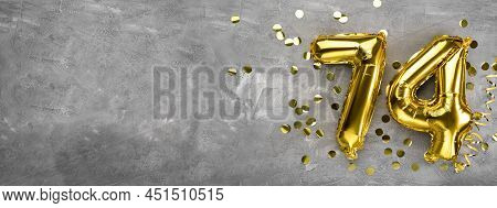Yellow Foil Balloon Number, Number Seventy Four On A Concrete Background. Greeting Card With The Ins