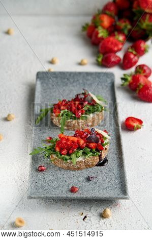 Two Bruscettas With Strawberry On A Plate