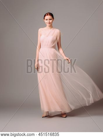 Bridesmaid's Dresses. Elegant Moscato Dress. Beautiful Pink Chiffon Evening Gown. Studio Portrait Of