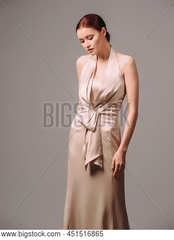 Bridesmaid's Dresses. Elegant Moscato Dress. Beautiful  Ivory Silk Evening Gown. Studio Portrait Of 