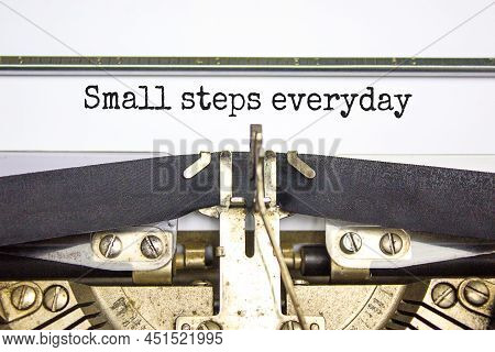 Small Steps Everyday Symbol. Concept Words Small Steps Everyday Typed On Retro Typewriter. Beautiful