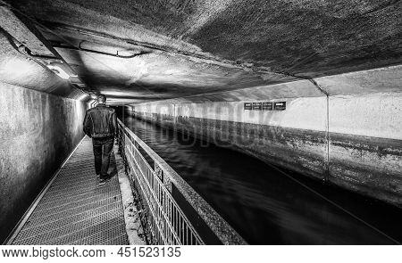 Anderlecht, Brussels, Belgium - 07 16 2019- The Covered River La Senne, With A Metal Walking Path At