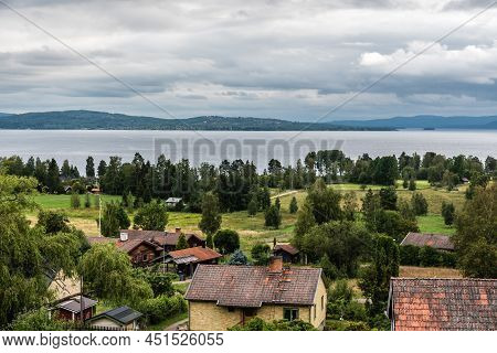 Segersta, Halsingland - Sweden - 08 04 2019: Panoramic View Over Old Village Houses With The Ljusnan