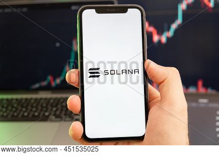 Solana Sol Cryptocurrency Logo On The Screen Of A Smartphone In Mans Hand With A Growing Trend On Th