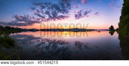 Panoramic View On Sunset At Lake Forggensee