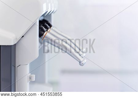 Dental Handpieces Cleans And Lubricates On A Special Machine. Professional Equipment Care.