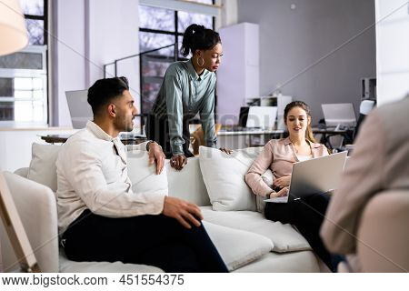 Young Diverse People Working In Coliving Space