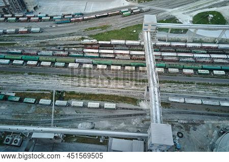 Aerial View Of Cargo Train Cars Loaded With Construction Goods At Mining Factory. Railway Transporta