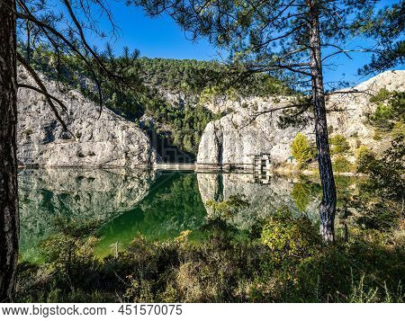 Embalse Del Molino De Chincha Reservoir With Turquoise Waters In Autumn At Cuenca Province In Castil