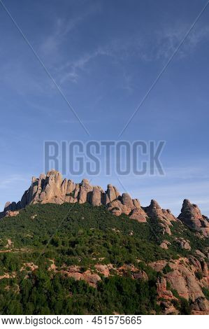 Montserrat Mountain Range With A Blue Sky.