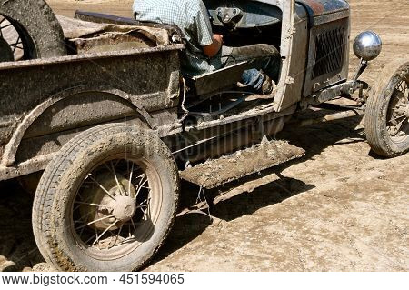 A  Side View Very Old Pickup Has Been Driven In Extreme Muddy And Dirty Conditions.