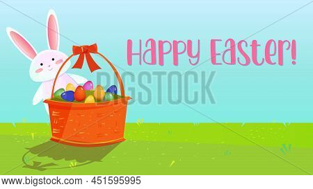 Easter Web Banner With White Bunny Standing Behind A Basket With Decorated Eggs. Green Grass And Blu
