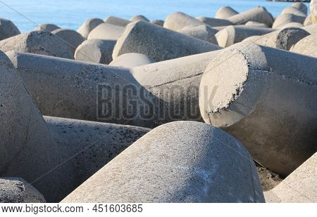 Large Concrete Breakwaters To Protect The Beach From Storm Surges