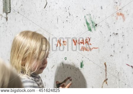 Kharkov, Ukraine- 3 March 2022: Ukrainian Girl Writes On Wall No War. Basement From Shelling Residen