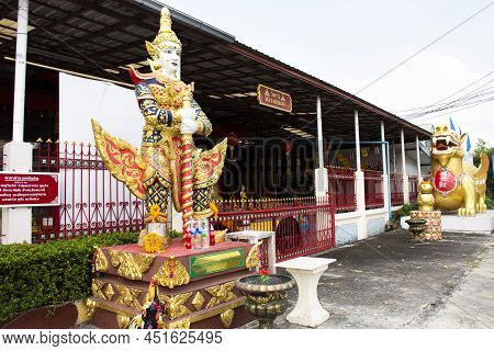Angel Guardian And Pixiu Or Pi Yao Creatures Of Myth And Legend At Gate Entrance Of Wat Daeng Pracha