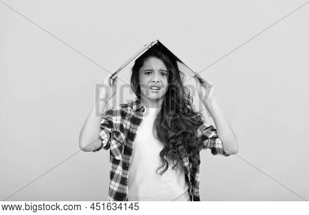 Unhappy School Girl Worry Holding Laptop Computer On Head For Distance Education, Telelearning