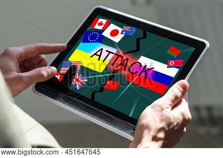 Ukrainian And Russian Flag On A Tablet And Inscription Attack.