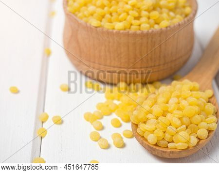 Dry Toasted Ptitim Pasta Close-up On A Wooden Spoon