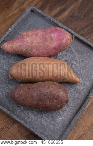 Colorful Root Vegetables Pink, Purple And Orange Organic Sweet Potatos