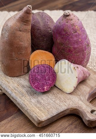 Colorful Root Vegetables Pink, Purple And Orange Organic Sweet Potatos