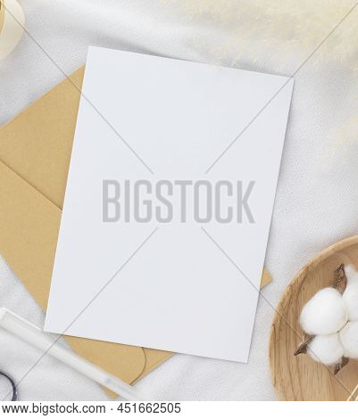 Blank Greeting Card Invitation Mockup 5x7 On Envelope With Dry Flowers And Ribbon On White Fabric Ba