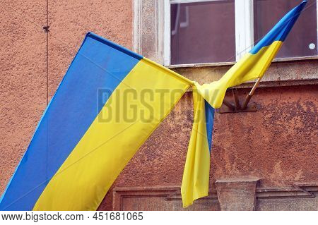 On The Facade Of The Building There Are Flags Of Ukraine As A Sign Of Solidarity With The People Def