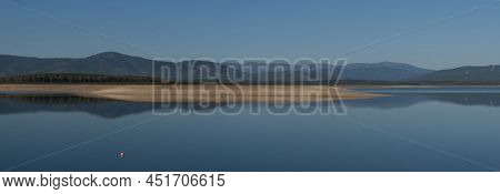 Panoramic View Of The Gabriel Y Galan Reservoir With The Sierra De Francia In The Background And A P