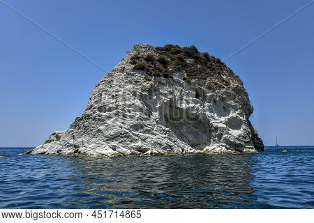 Santorini White Beach With A Bright Blue Sky And The Blue Sea In Greece.