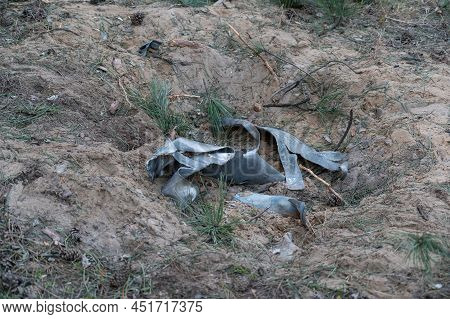 Remains Of The Grad Multiple Rocket Launcher In The Crater. Consequence Of The Shelling Of The City 