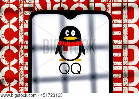Kazan, Russia - Mar 27, 2022: Tencent Qq Chinese Messaging Service Logo On Smartphone Screen Behind 