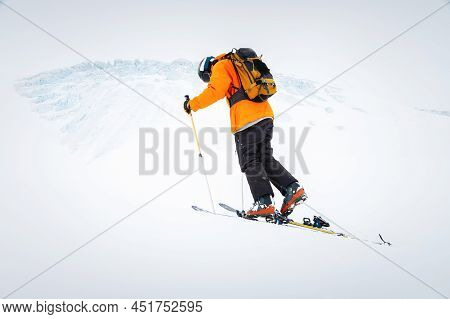 Winter Skitour Freeride In Cloudy Weather, Snow-capped Mountains Against The Backdrop Of A Glacier. 
