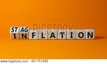 Stagflation Or Inflation Symbol. Turned Wooden Cubes And Changed The Concept Word Inflation To Stagf