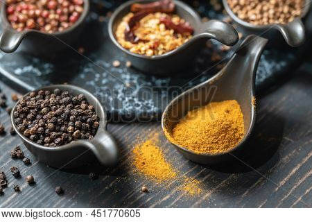 Food, Spices And Ingredent Concept. Closeup Of Spoon Of Yellow Curcuma Powder And Black Pepper With 