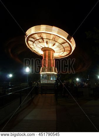 Long Exposure Of Amusement Park Ride At Night