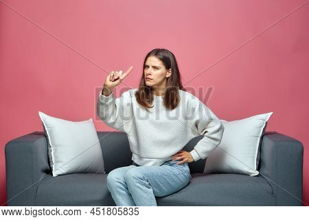 Be Careful. Serious Frowning Girl Warning With Admonishing Finger Gesture Disapproving Looking At Ca