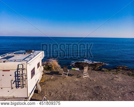 Spanish Rocky Coastline With Camper Car Camping On Cliff Sea Shore. Mediterranean Region Of Villaric