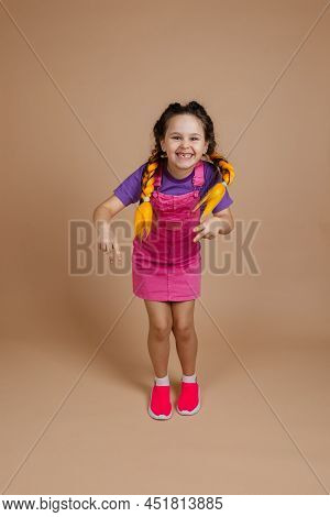 Energetic Happy Shining Little Girl With Kanekalon Braids Showing Piece Signs With Hands Having Fun 