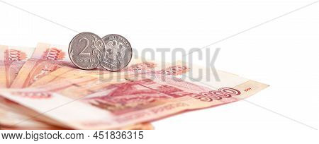 Coin Of 2 Russian Rubles On A Banknote Of 5000 Rubles. Money Of The Russian Federation.