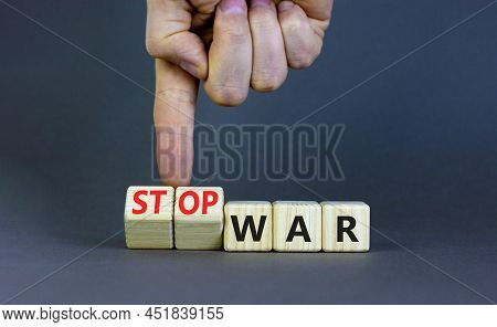 Stop War Symbol. Businessman Turns Cubes And Changes Concept Words War To Stop War. Beautiful Grey T
