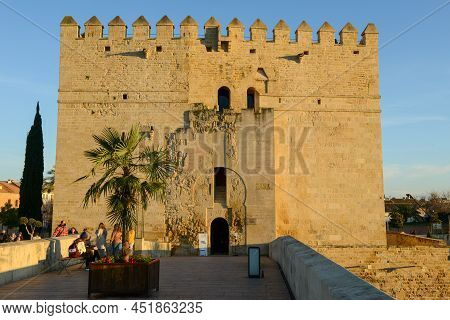 People Walking On The Old Roman Bridge At Cordova On Andalusia In Spain