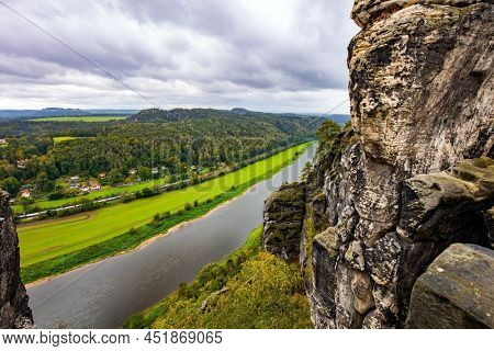 Germany. The magnificent German river Elbe. The sandy cliffs of Bastei, 200 meters high above the Elbe River, are a famous tourist attraction. Artists' road Malerweg in Saxon Switzerland.
