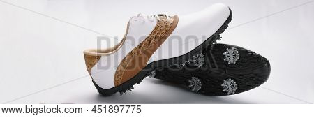 Close-up Of Pair Of Modern Fashionable Shoes With Unique Design, White With Combination Of Gold Colo