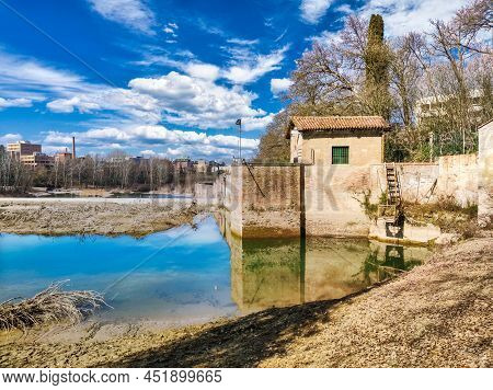Casalecchio Dam On A Sunny And Cloudy Day Of Spring