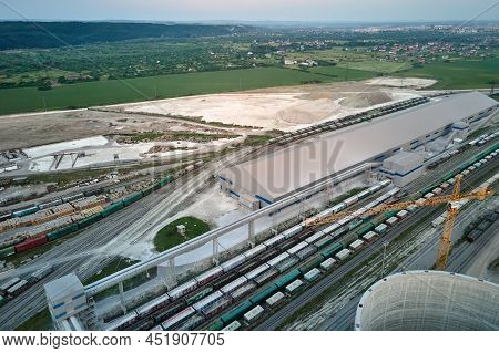 Aerial View Of Cargo Train Cars Loaded With Construction Goods At Mining Factory. Railway Transporta