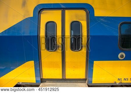 Amsterdam, Netherlands, March 2022. Open And Closed Doors Of A Dutch Train.