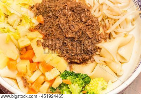 Traditional Chinese Pork Meat Cooked In A Salty, Fragrant Sauce, Then Served With Noodles And Variou