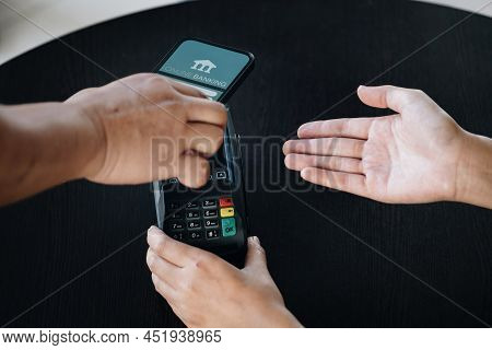 Payment Security Technology Concept And Service Fees, Employees Are Holding Electronic Card Machines